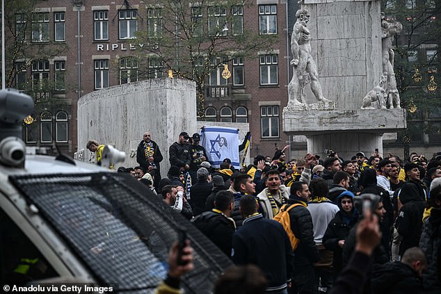 Maccabi Tel Aviv fans hold a pro-Israel demonstration on Dam Square, lighting torches and chanting slogans ahead of the UEFA Europa League match