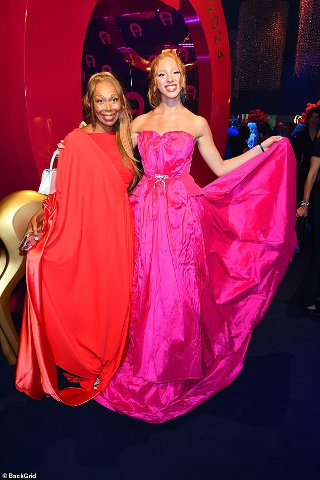 While mum Angela, 56, was the epitome of style as she posed in her red floor-length dress