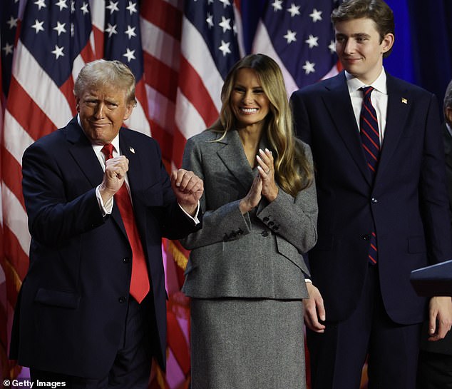 Meanwhile, the politician's youngest son, Barron, 18, towered behind his father in a suit and striped tie with an American flag pin on the lapel