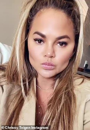 Teigen's face (pictured in late 2021) looks more angular after receiving the procedure