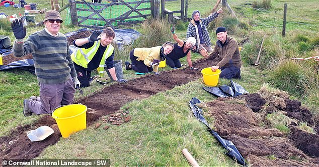 The researchers (pictured) hope that by providing an accurate date for the location, they can help unravel the mystery of why King Arthur's Hall was built and what it was used for.