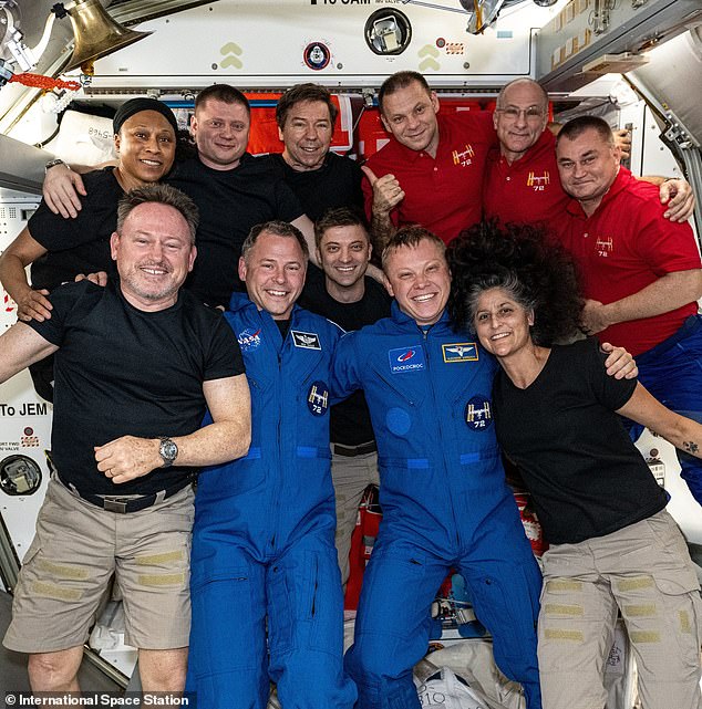 Wilmore (front left) and Williams (front right) pose with the other members of the Expedition 72 crew for a photo posted on October 4