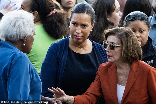 Pelosi spoke emphatically to Democratic bosses during Harris' concession speech. Above, she is seen in conversation with Donna Brazile, the former DNC boss, and DC Mayor Muriel Bowser