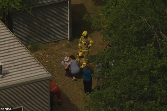 Concerned parents were initially separated from students by fallen power lines, but were then able to hug their children after crews cleared the danger.