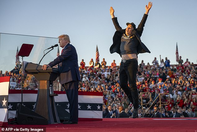 Musk jumps on stage as he joins Trump at a campaign rally at the site of his first assassination attempt in Butler, Pennsylvania on October 5, 2024.