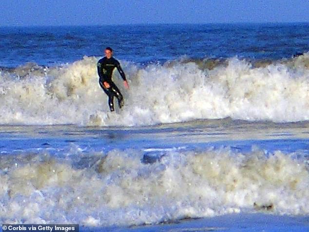 William rides a wave during his final year at university in Scotland