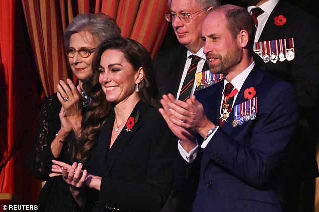 Kate clapped enthusiastically next to husband Prince William, while the Duke and Duchess of Gloucester stood behind them