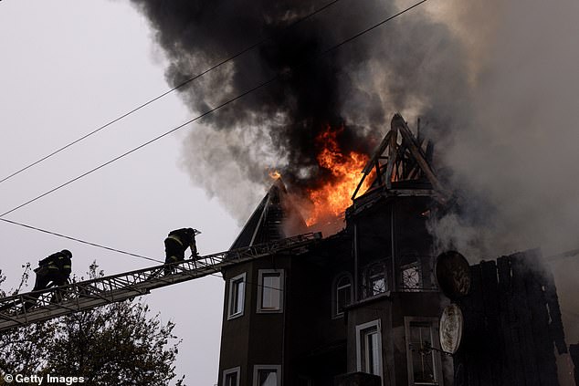 Ukrainian firefighters respond to an artillery attack on November 10, 2024 in Pokrovsk, Ukraine