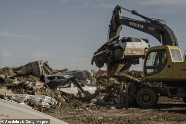 The piles were each as high as six vehicles, with the bottom cars often the most damaged