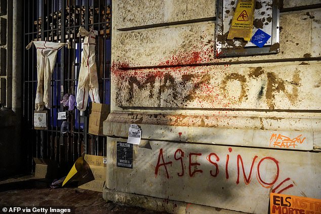 Graffiti is seen on the facade of the town hall during a demonstration to demand the resignation of Valencia Regional President Carlos Mazon in Valencia on November 9, 2024