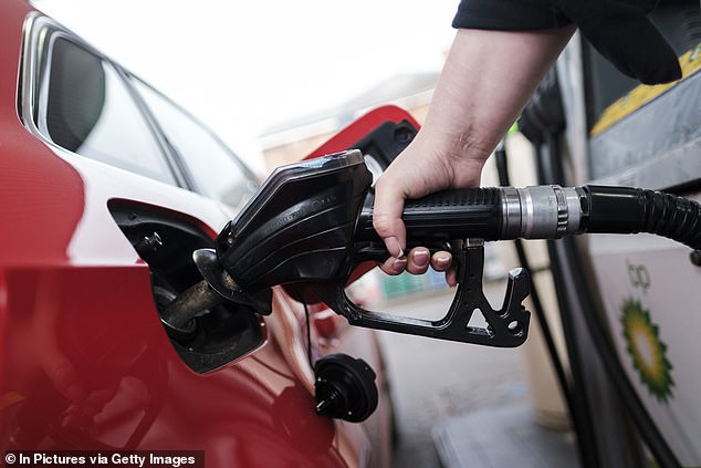 In 2022, Volkswagen agreed to pay £193 million to more than 90,000 British drivers following the 2015 scandal (pictured is a file image of someone filling up a car with diesel)