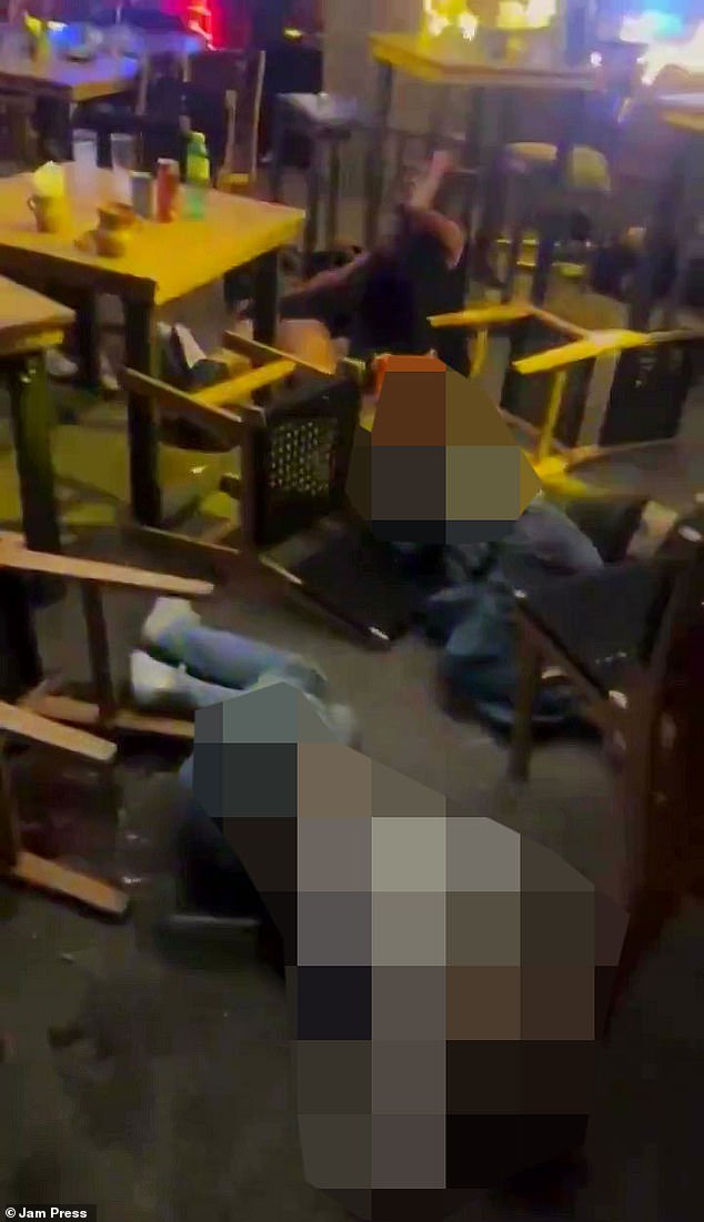 People were seen lying on the ground after being shot by the gunmen