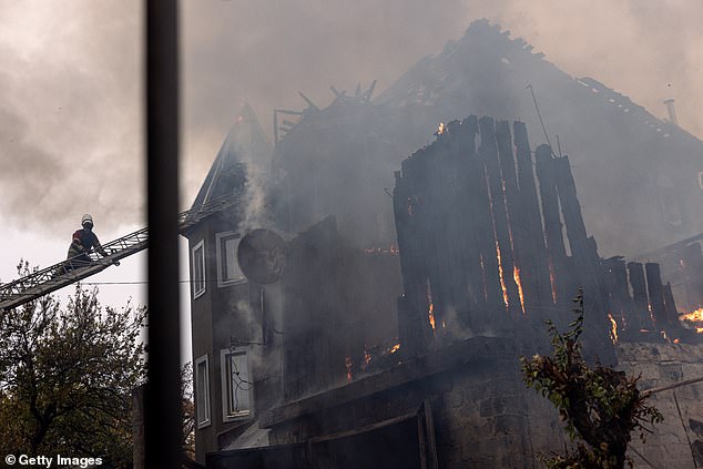 Ukrainian firefighters respond to an artillery attack on November 10, 2024 in Pokrovsk, Ukraine