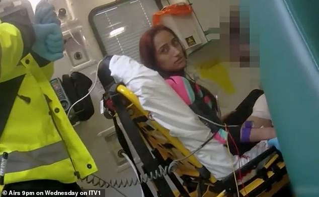 Ahmed sits in an ambulance after stabbing herself in the leg in an attempt to frame her former lover