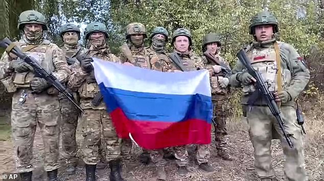 In a video released by the Russian Ministry of Defense on Monday, November 4, 2024, Russian soldiers record video congratulations at a secret location in Ukraine