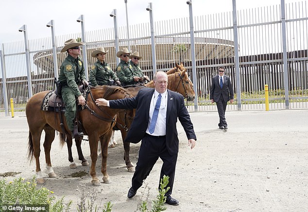 Homan speaks with Border Patrol agents along the southern border wall in San Ysidro, California on May 7, 2018