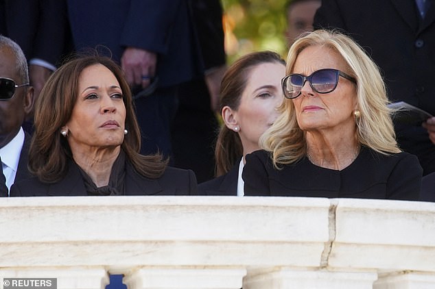 A stoic-looking Vice President Kamala Harris (left) sat next to first lady Dr. Jill Biden (right) waiting for President Joe Biden's remarks during the Veterans Day ceremony at Arlington National Cemetery on Monday