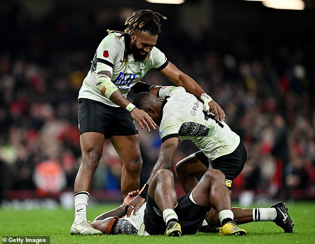 Fiji players celebrated emphatically after completing a famous victory over Wales in the Principality