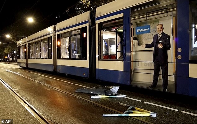 Windows of the tram in Amsterdam were smashed due to the violence, the police say it is unclear who started the fire