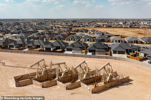 Oil is the name of the game in West Texas with these yes-men in the middle of a residential neighborhood in Midland, Texas