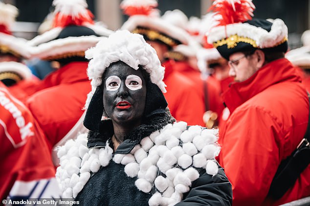 She was also seen with pieces of cotton stuck to her outfit as she attended the opening of Dusseldorf's traditional carnival season on November 11.