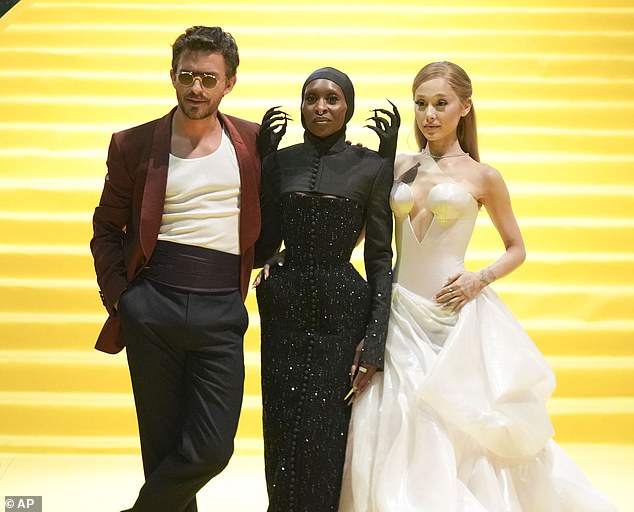 At the event, she posed alongside co-stars Cynthia Erivo and Jonathan Bailey, who wrapped their arms around her petite frame