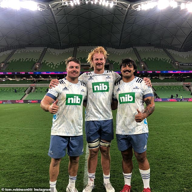 Robinson (pictured center with teammates) said the concussion symptoms became so bad that he hoped he would not be called up to play for the All Blacks