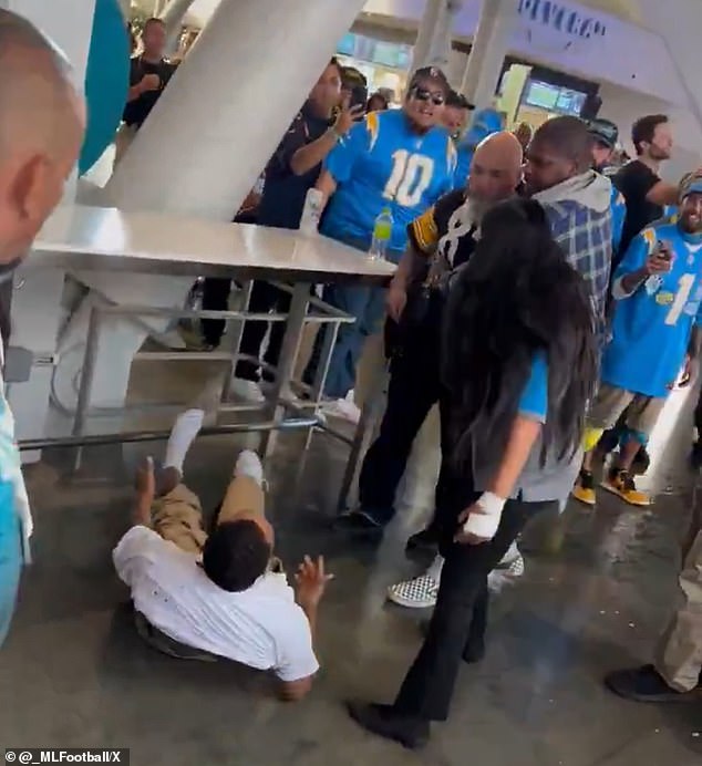 Spectators managed to get the fan away from his rival, who was bleeding his white T-shirt