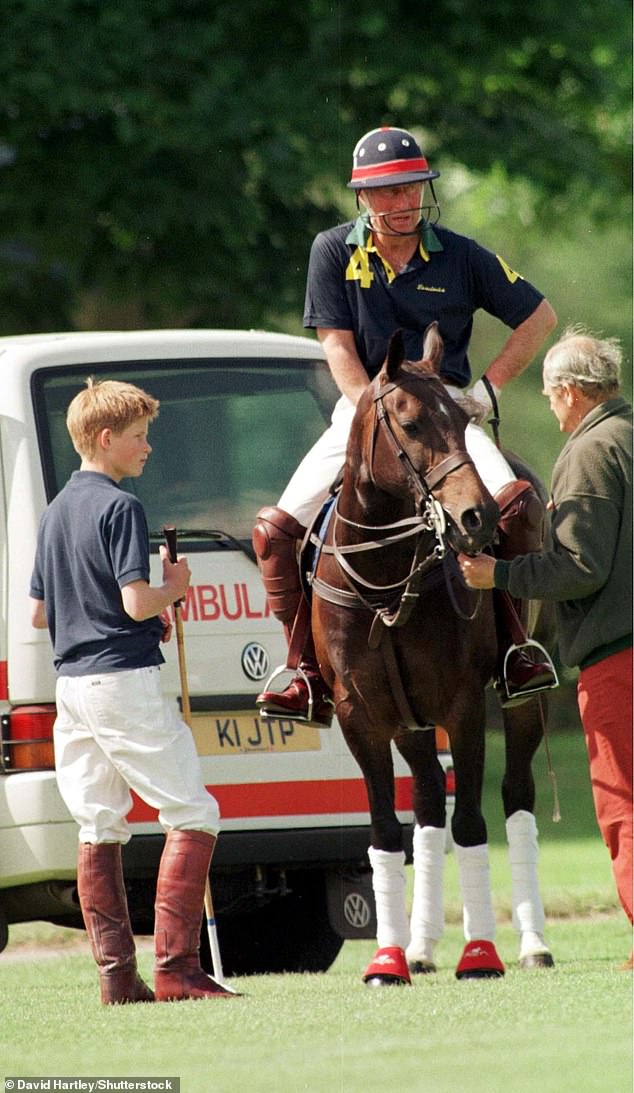 Prince Charles with son Harry during a polo match in Cirencester Park, Gloucestershire, in 1999