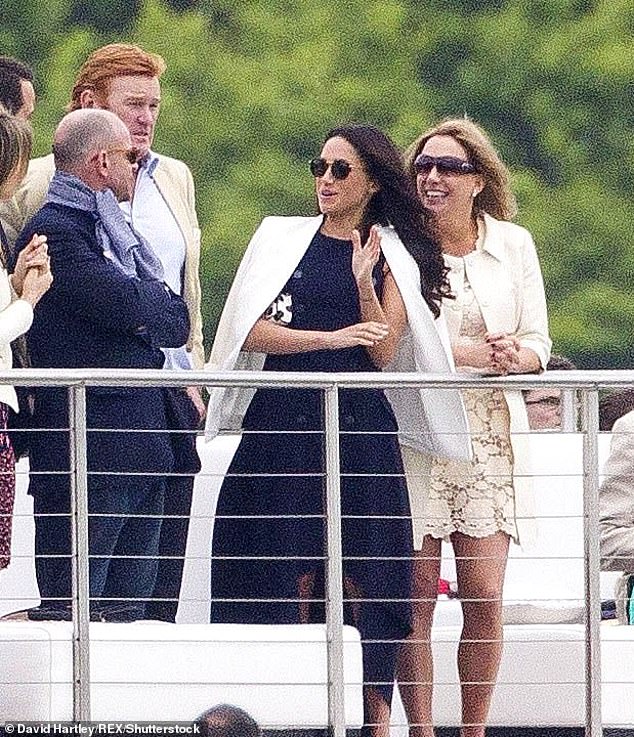 Meghan watches Harry take part in a polo match at Coworth Park in Berkshire in 2017