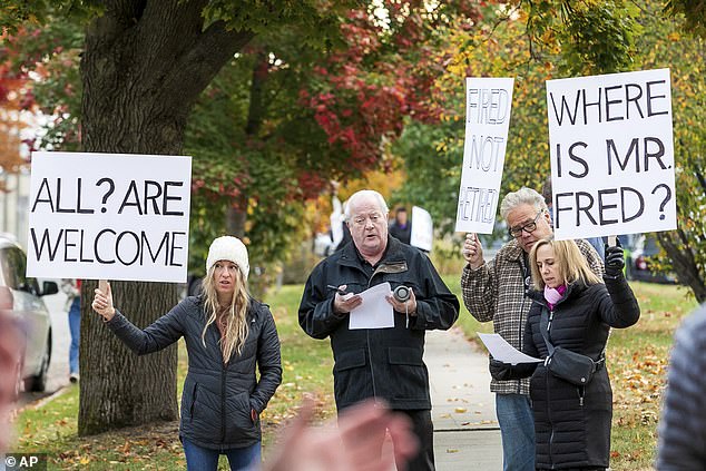 Protesters held signs reading: “Love Not Hate,” “God Includes, Not Excludes,” and “Fired Not Retired.”