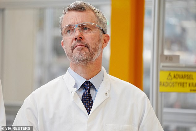 King Frederik wore goggles and a lab coat during the visit