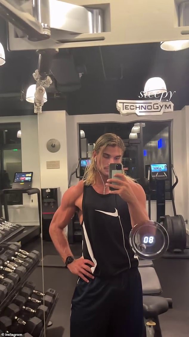 He wore a black Nike tank top that showed off his rippling biceps, deltoids and pecs. His signature blonde mullet was on full display, with some of the party pushed behind his ears as he worked on his angles.