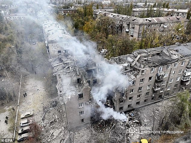 A photo made available by the State Emergency Service of Ukraine shows the site of a rocket attack on a five-story residential building in Kryvy Rih, Ukraine, November 11, 2024