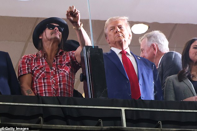 Donald Trump and Kid Rock are seen during an Alabama-Georgia game in Tuscaloosa