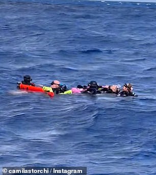 They found five divers all clinging to each other to stay afloat and one in the midst of hypothermia after accidentally becoming separated from their tour boat.