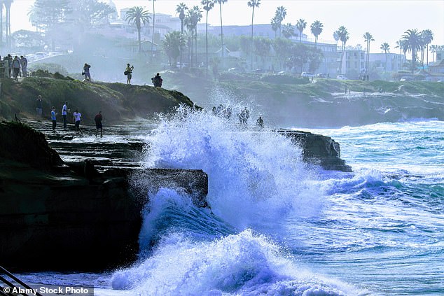 Even the most experienced swimmers have been warned to stay out of the water as the large waves can create a strong undertow that will pull people into the sea (stock)