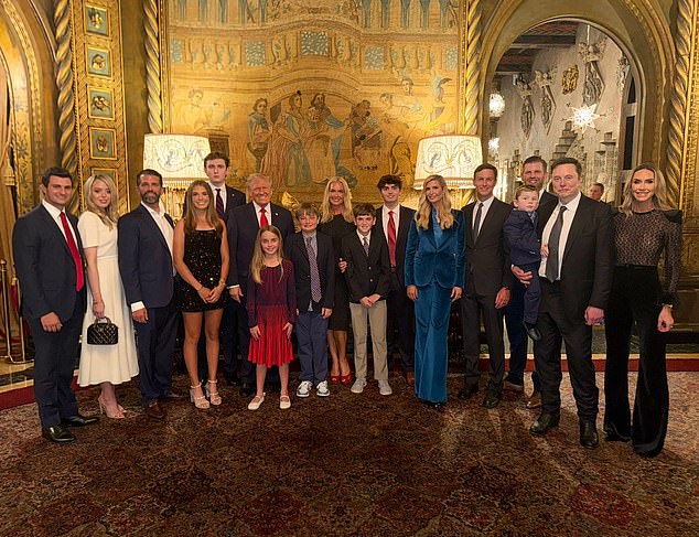 Elon Musk (second from right) appears in the Trump family photo on election night as family, friends and political allies gathered at Mar-a-Lago