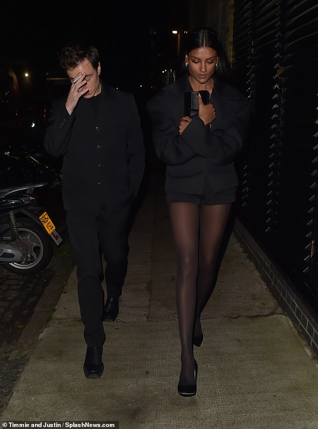 Simone, who posed for the calendar, showed off her long legs in tiny shorts, paired with tights and stilettos as she left the restaurant with a male friend