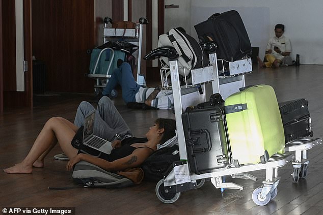 Thousands of passengers are stranded at Denpasar International Airport (pictured) as major airlines only consider resuming flights to and from Bali on Thursday