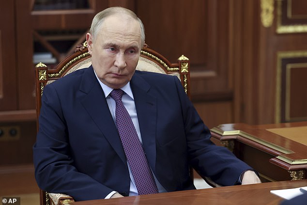 Vladimir Putin pictured in the Kremlin on November 12 during a meeting