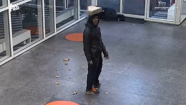 A man, believed to be Levis E., is seen balancing a concrete block on his head before launching an attack