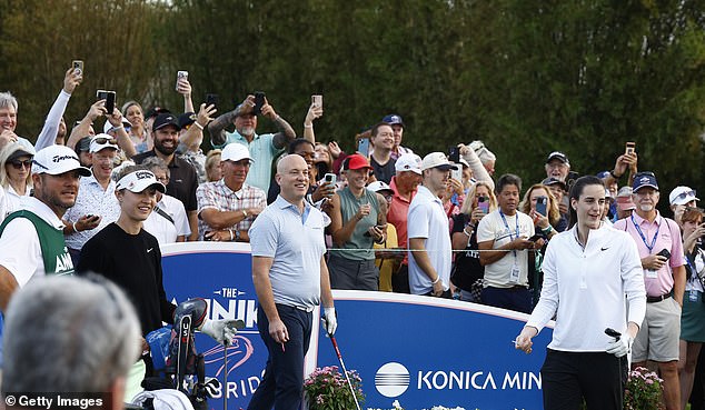 Clark and fans react after her tee shot flew into the crowd at Pelican Golf Club in Florida