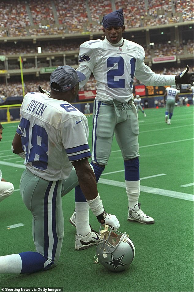 Dallas Cowboys teammates Michael Irvin and Deion Sanders prepare for the season opener against the Pittsburgh Steelers on August 31, 1997 at Three Rivers Stadium