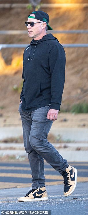 The star wore a hoodie and jeans for his day out without his wife