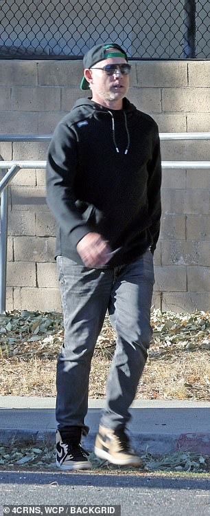 The star wore a hoodie and jeans for his day out without his wife