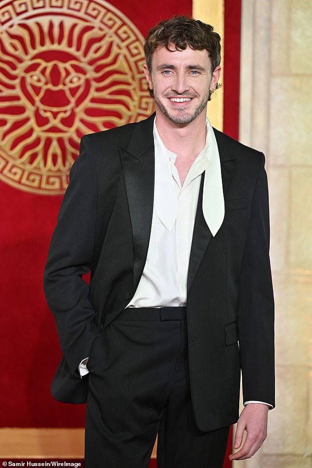 Paul, who plays the former heir to the Roman Empire Lucius Verus in the blockbuster, opted for a sleek black suit with a cream-colored satin shirt