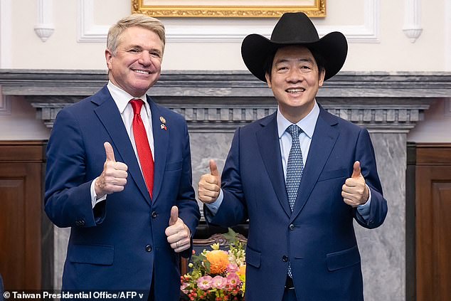 Taiwanese Presidential Office shows Taiwanese President Lai Ching-te (R) posing with a hat received from McCaul on May 27, 2024