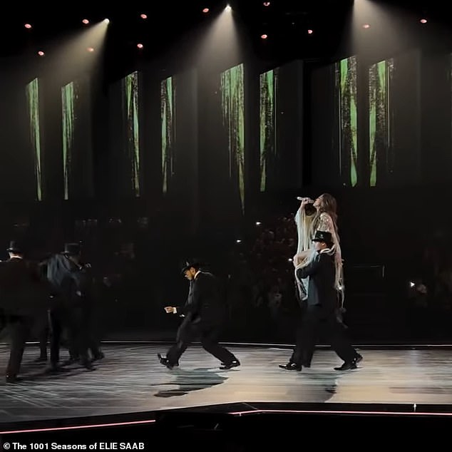 Jennifer was carried across the stage by a group of suit-clad men as she sang her heart out