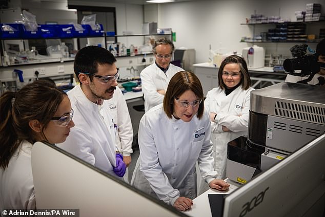 Chancellor Rachel Reeves looks at a computer analyzing cell sorting experiments during a visit to Quell Therapeutics' new office in London